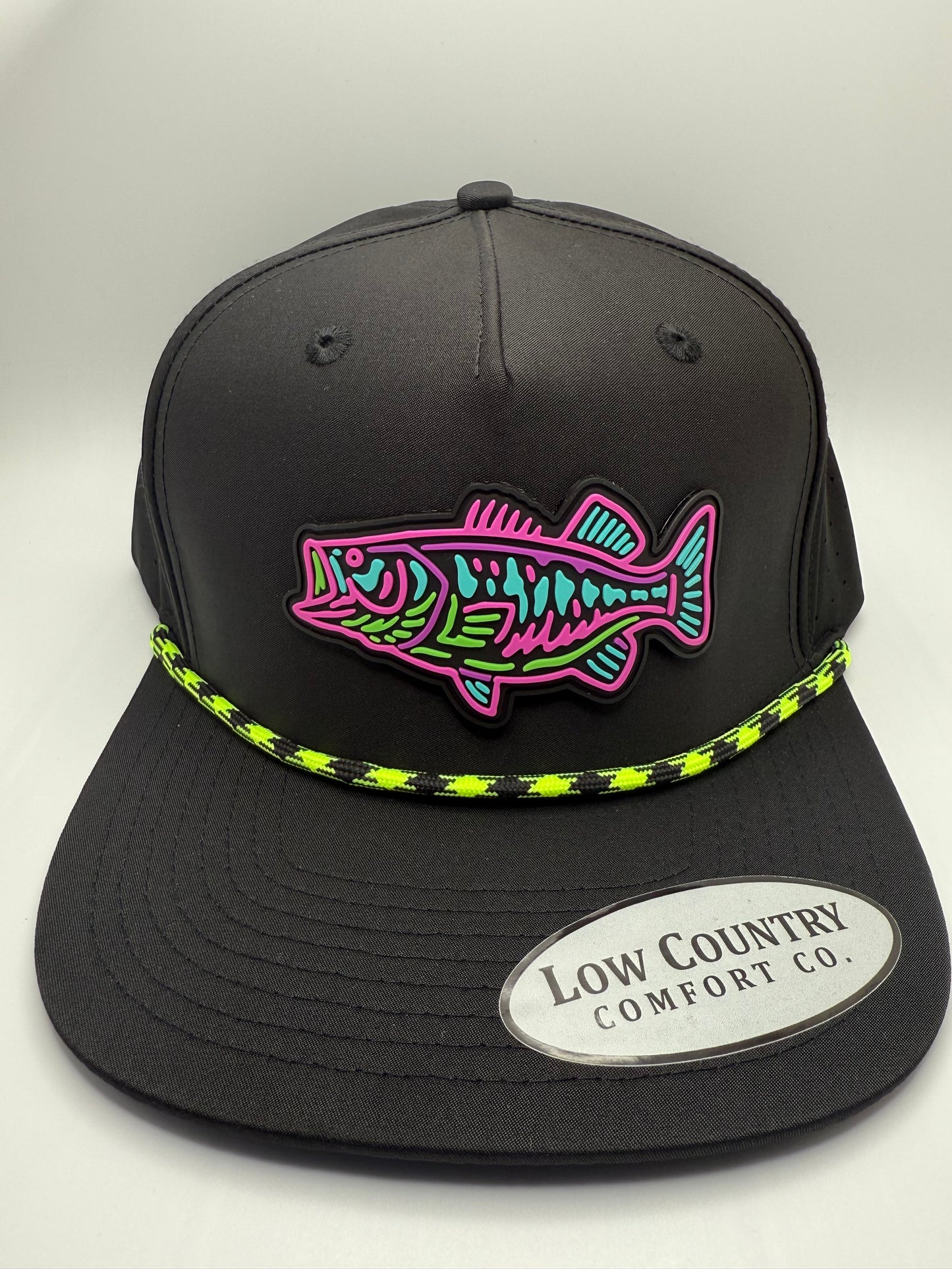 Bass Glow PVC Patch on a Riverbed Threads Black with Black/Green Rope Performance Hat