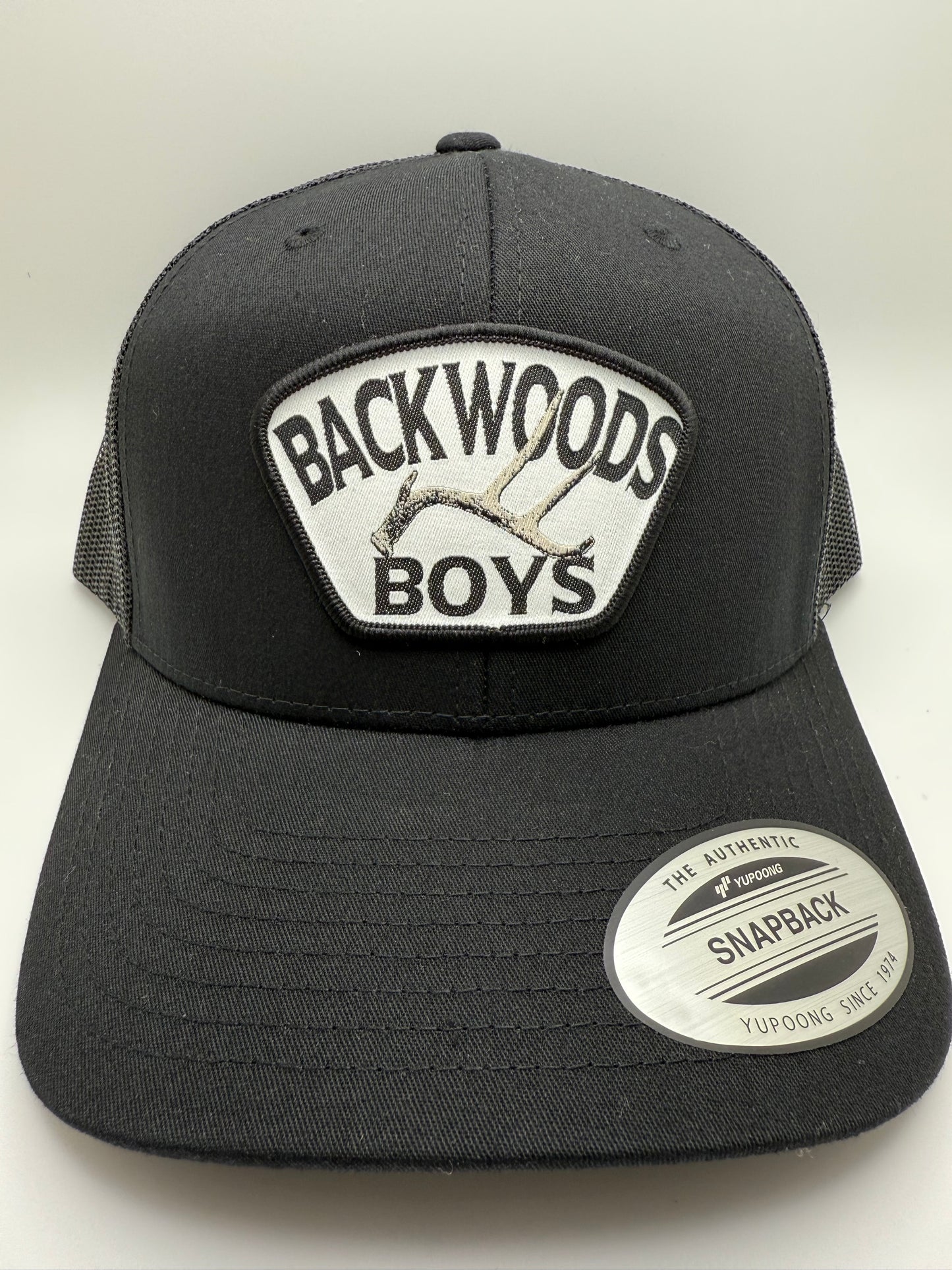 Backwoods Boys Deer Antler Sublimated Patch on a Solid Black Trucker Hat