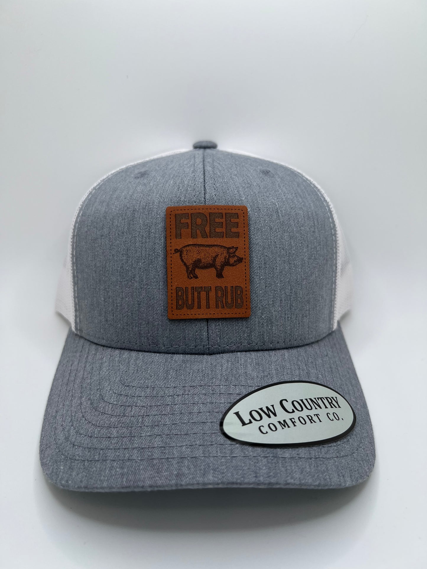 Free Butt Rub Leather Patch on a Heather/White Trucker Hat