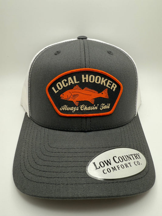 Local Hooker Always Chasin Tail Sublimated Patch on a Charcoal/White Trucker Hat