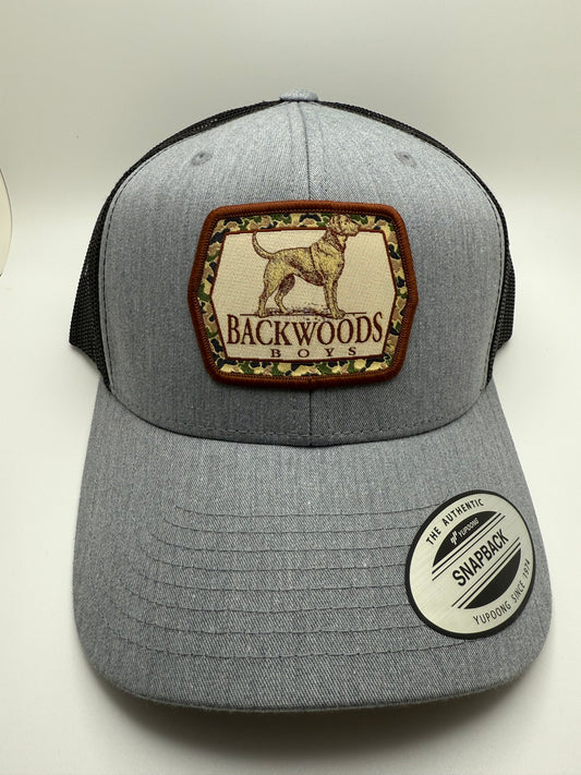 Backwoods Boys Pointer Dog Sublimated Patch on a Heather/Black Trucker Hat
