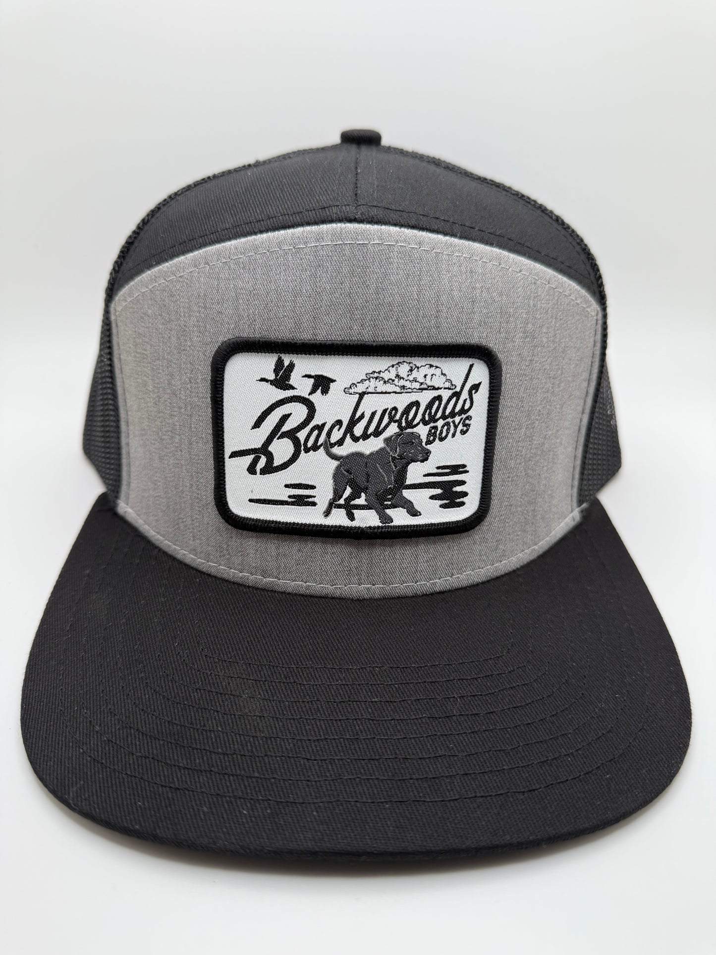 Backwoods Boys Running Dog Sublimated Patch on a Heather/Black 7 Panel Hat