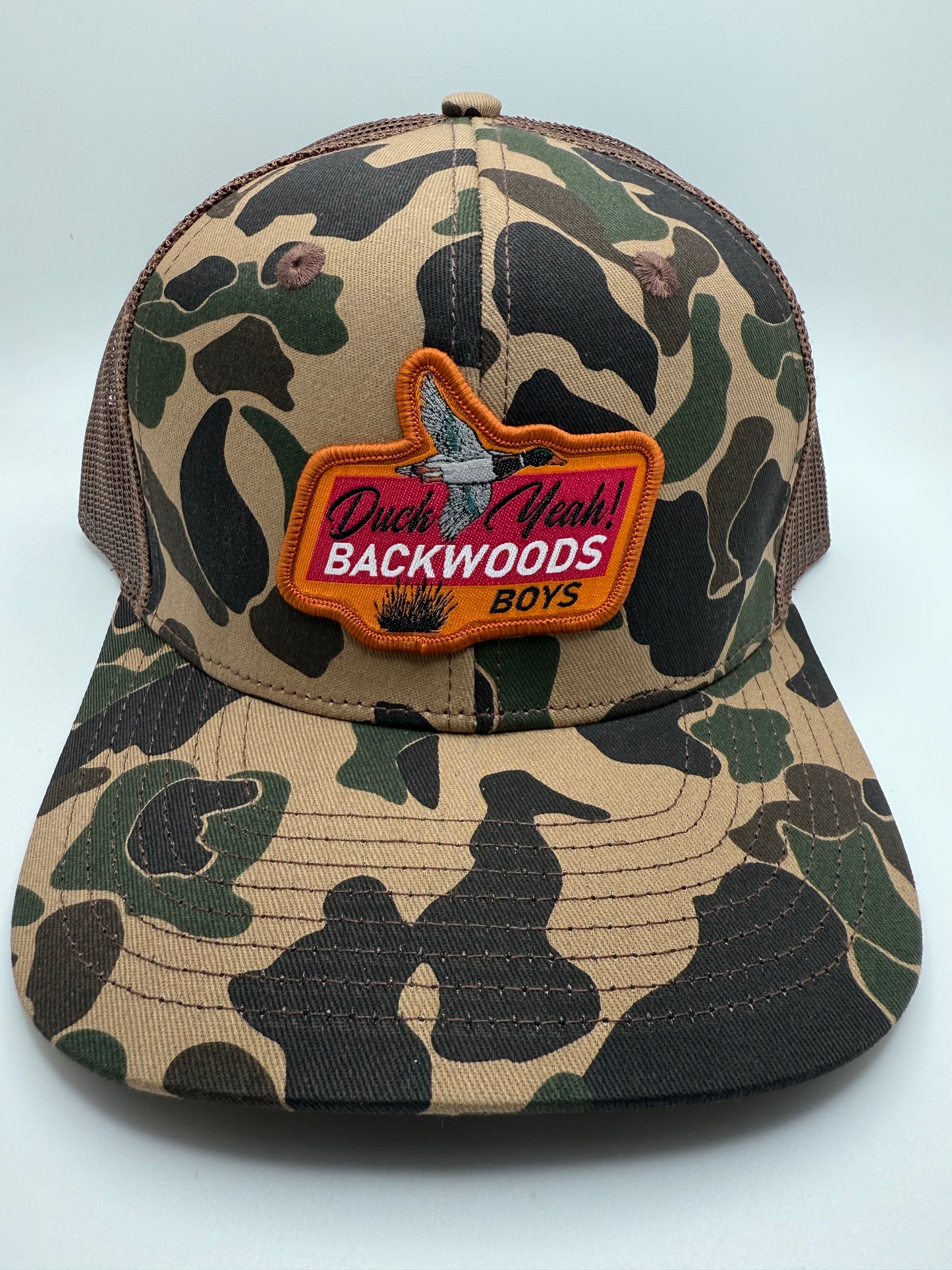 Backwoods Boys Duck Yeah Sublimated Patch on a OS Camo/Brown Trucker Hat