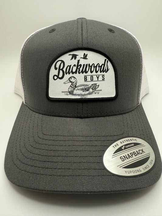 Backwoods Boys Floating Duck Sublimated Patch on a Charcoal/White Trucker Hat