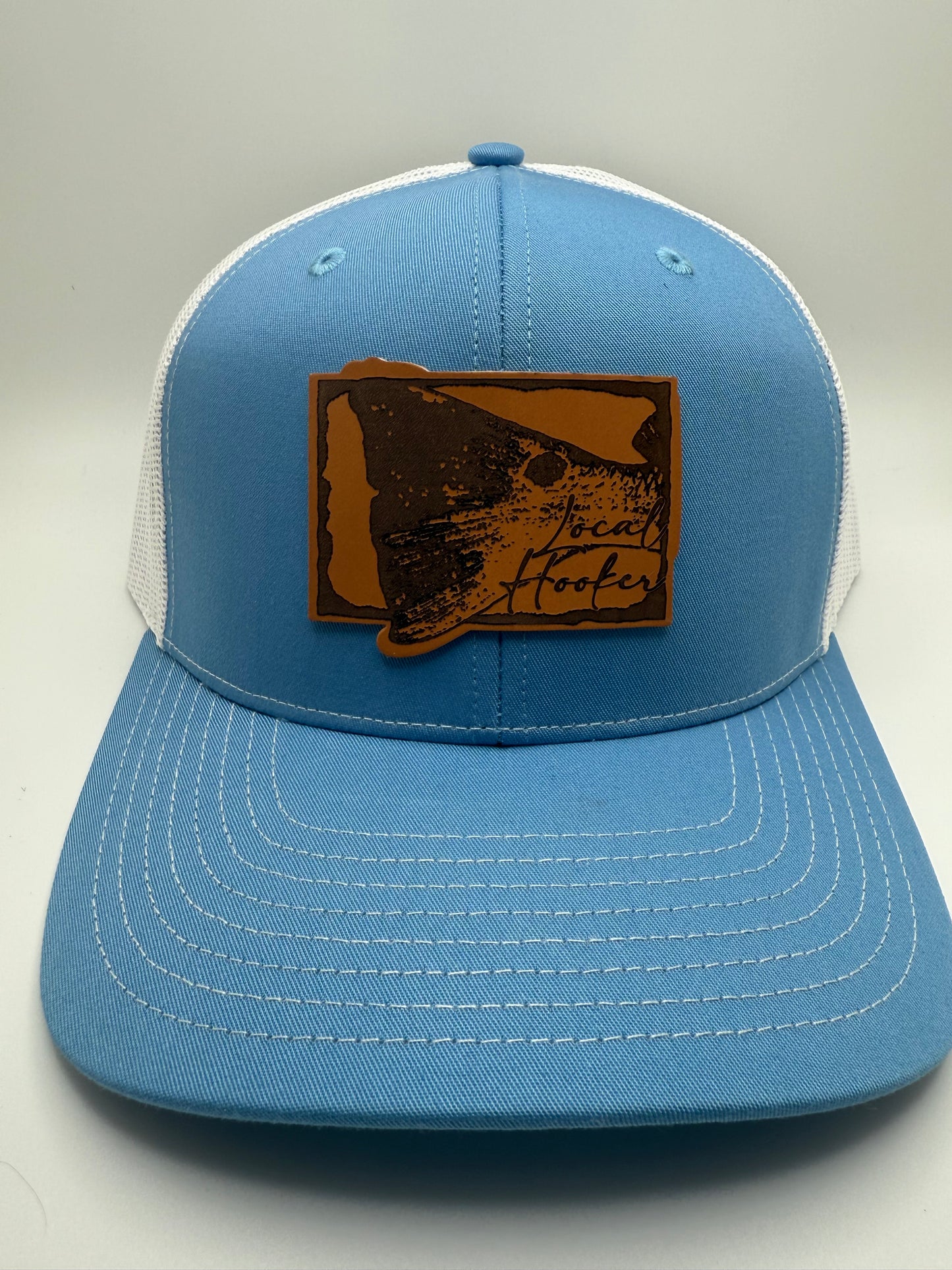 Local Hooker Leather Red Drum Tail Patch on a Col Blue/White Trucker Hat