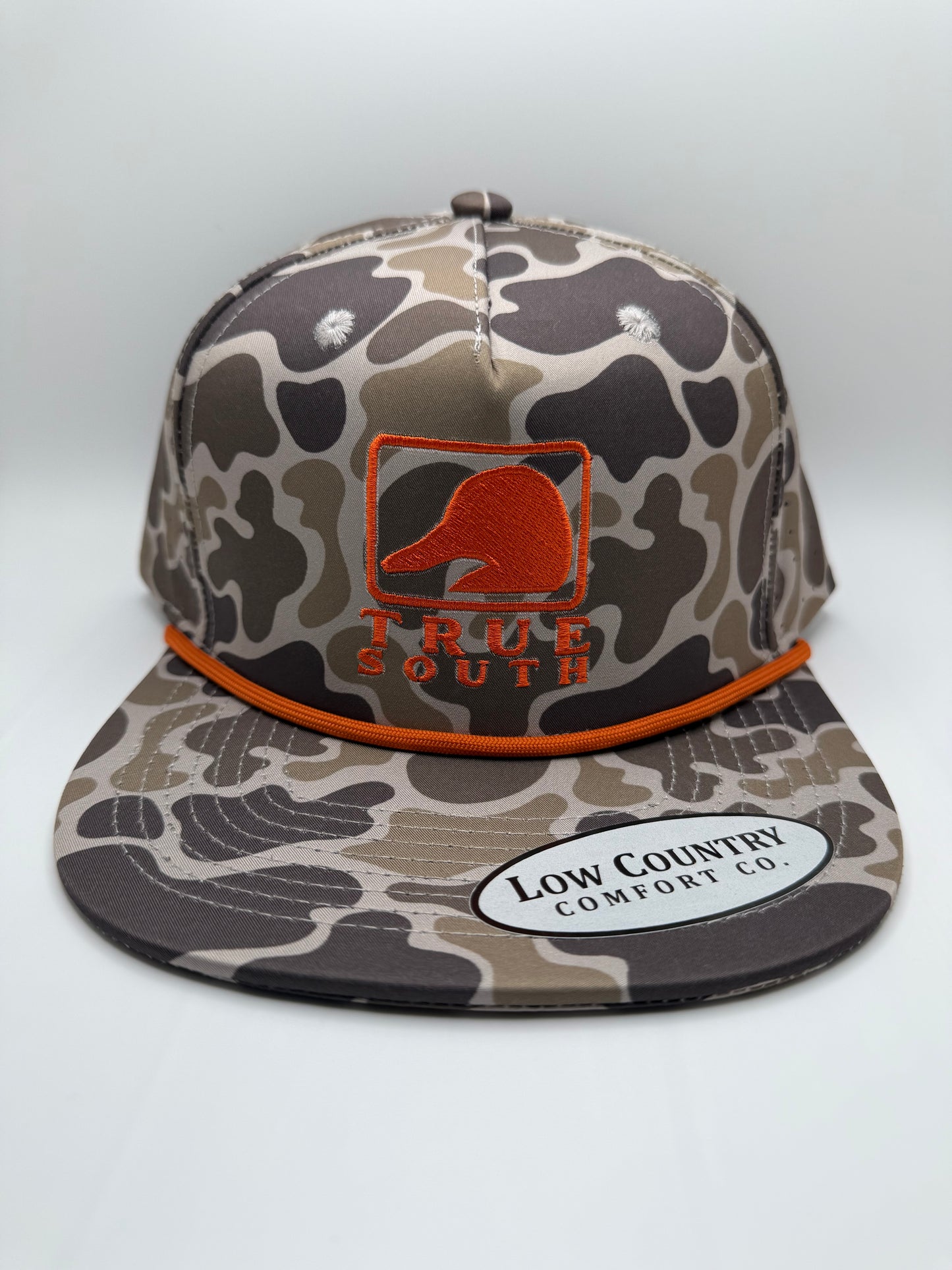 True South Square Duck Orange Embroidery on a Camo 5 Panel Riverbed Threads Performance Hat With Orange Rope