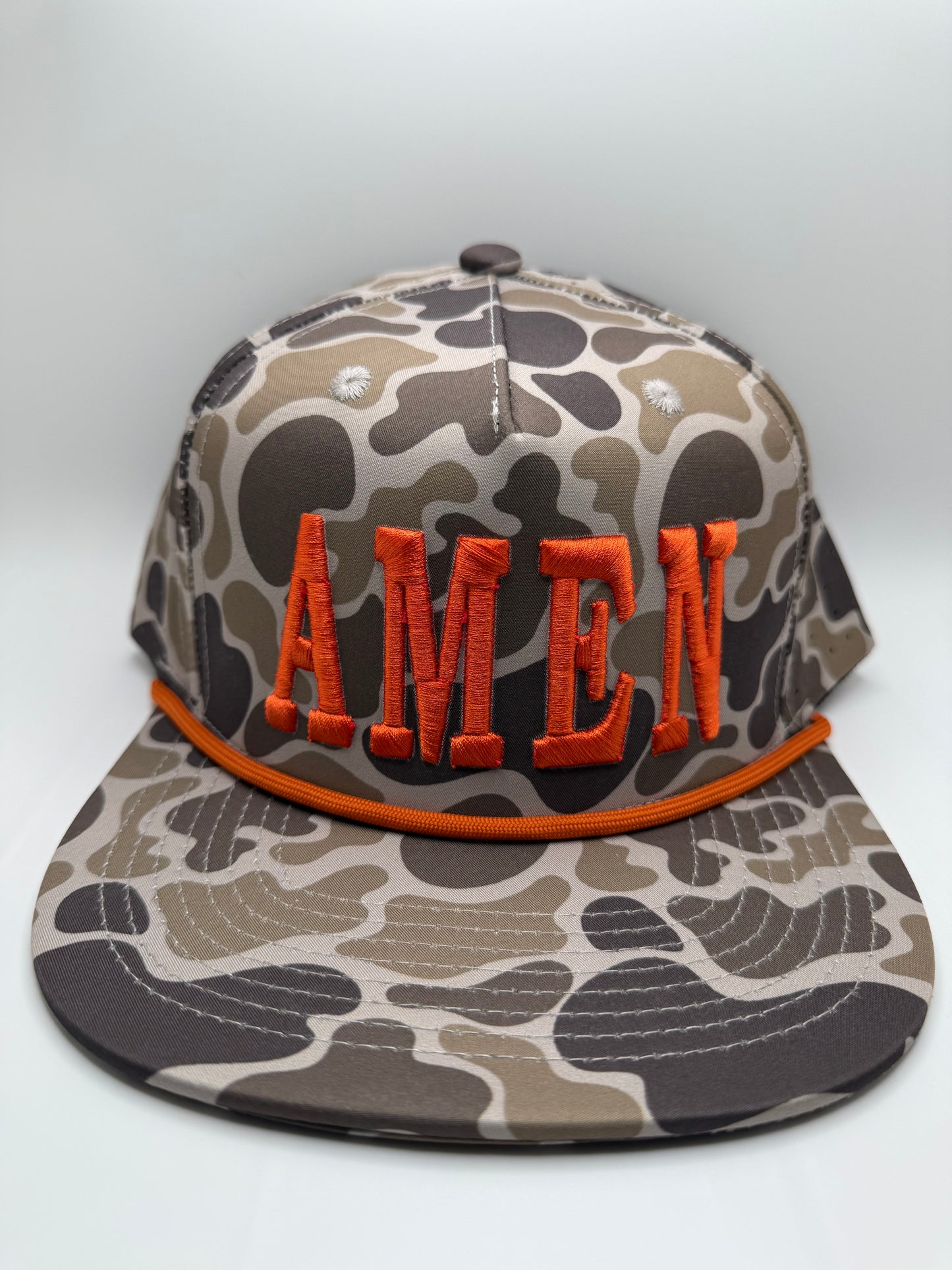Amen Orange 3D Puff Embroidery on a OS Camo 5 Panel Performance Rope Hat